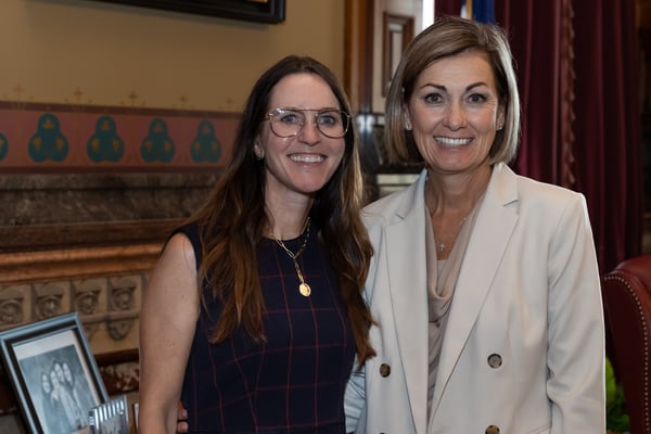 "County Materials' Technical Resource Engineer, Jennifer Schaff and Iowa Governor, Kim Reynolds at the proclamation signing."