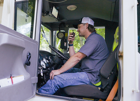 County Materials professional driver operating a concrete delivery truck, representing skilled drivers in construction logistics.