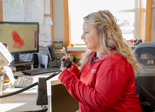 County Materials team member working at a computer in an office.