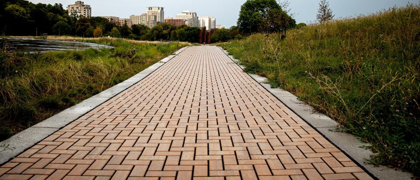 Close-up of a permeable paver walkway with the Milwaukee skyline on the horizon.
